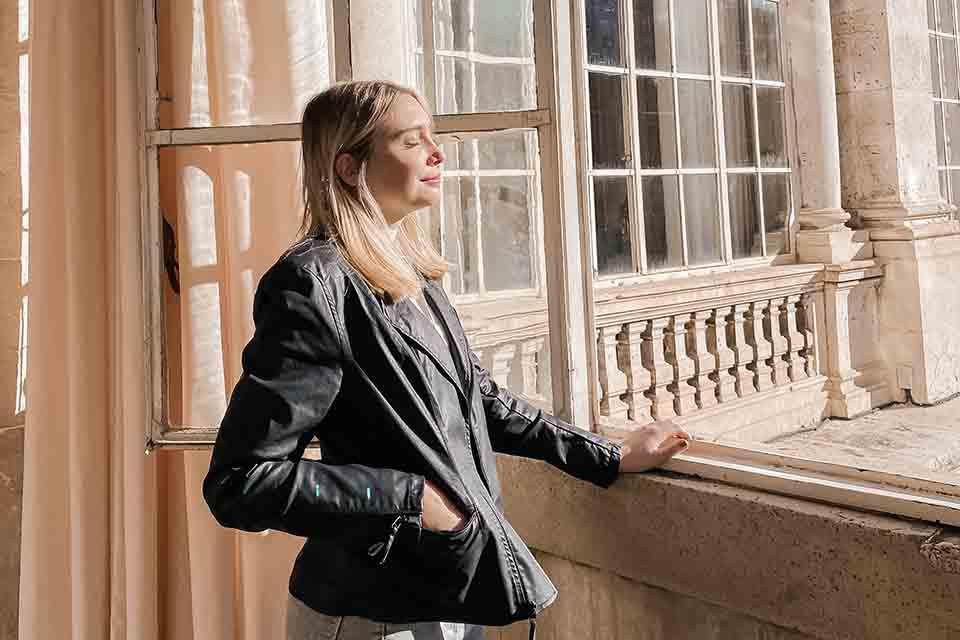 Woman standing at window